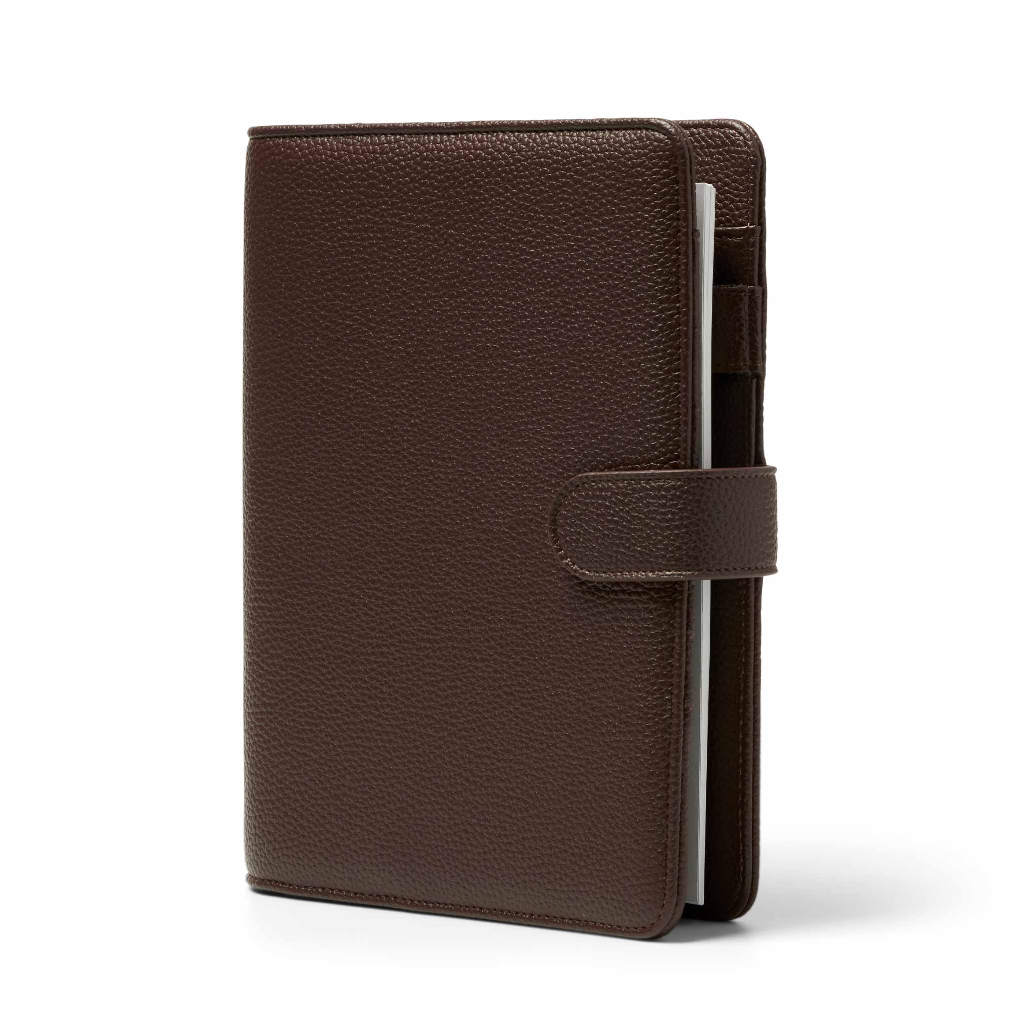 The Head Plan Agenda A5 espresso vegan leather ring binder angled to show free insert pack, clasp, and pen holder #color_espresso