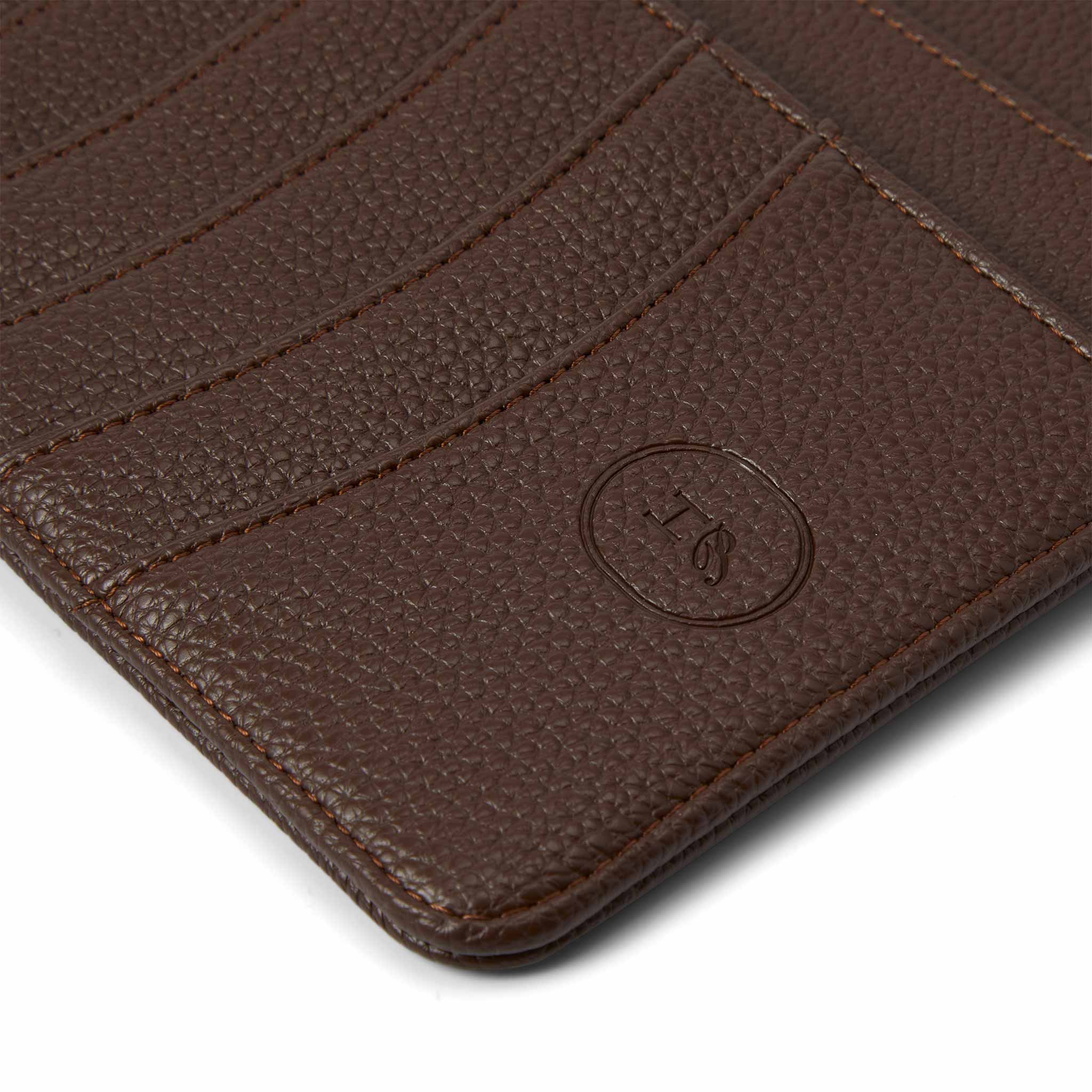 Close-up of The Head Plan Agenda in the colour Espresso showing vegan leather texture and logo embossing detail #color_espresso