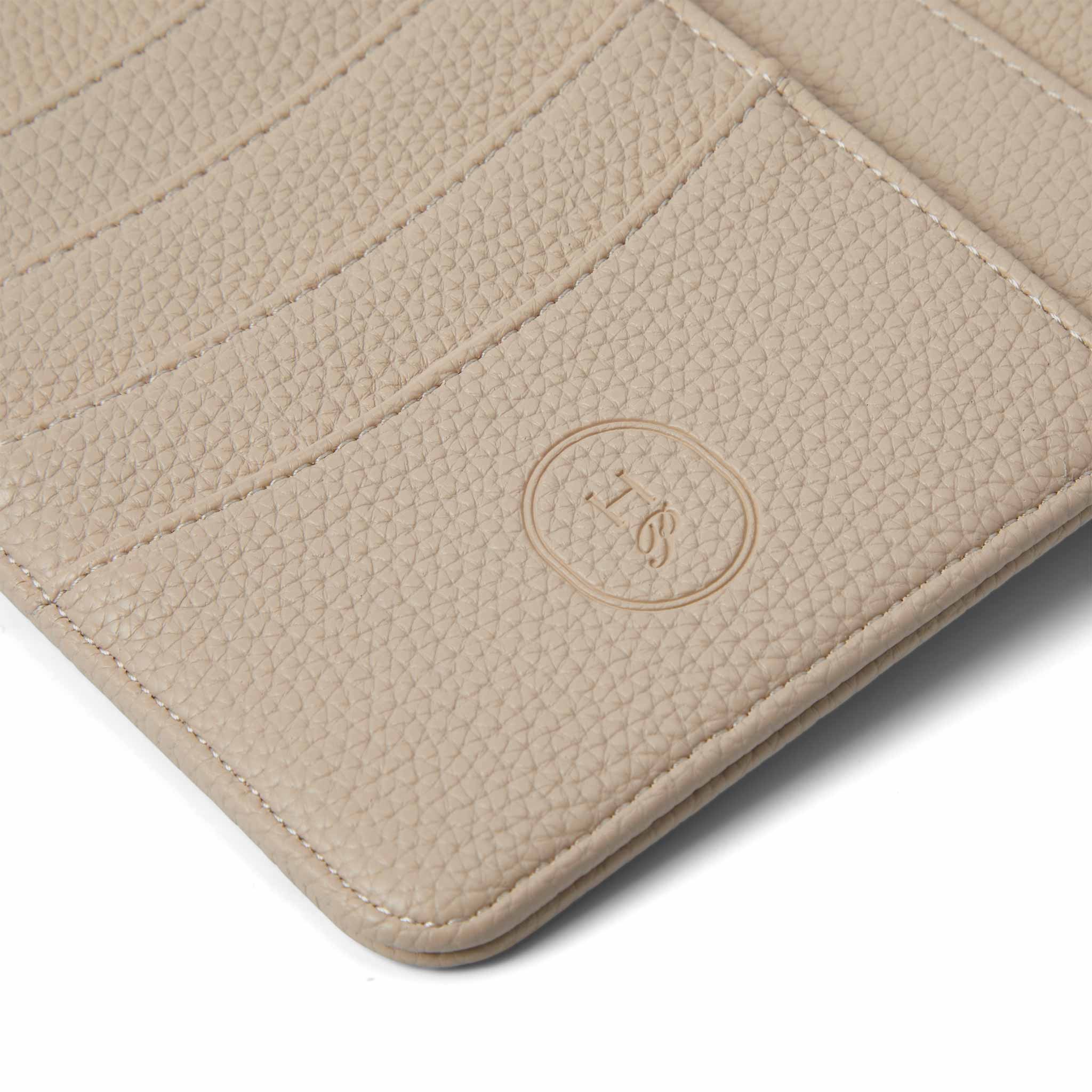 Close-up of The Head Plan Agenda in the colour Nude showing vegan leather texture and logo embossing detail #color_nude