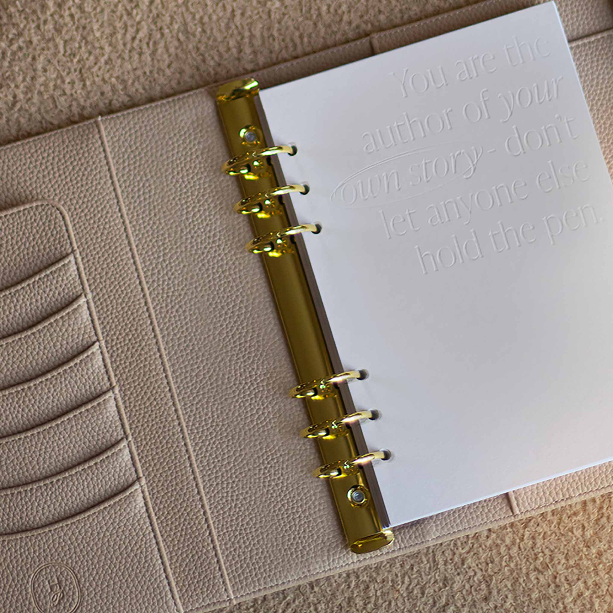 Lifestyle image of The Head Plan A5 nude vegan leather ring binder Agenda open #color_nude