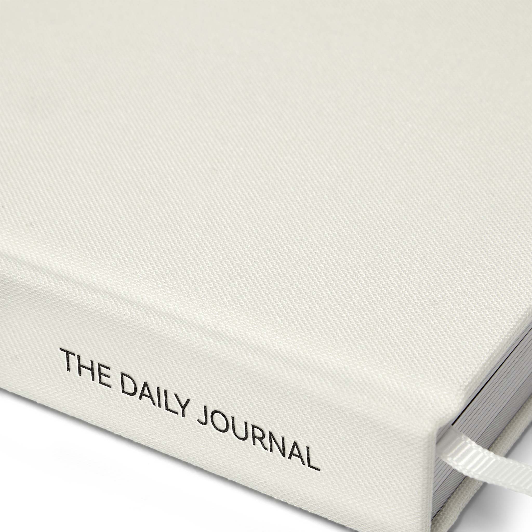 Close up of the journal by Roxie Nafousi in Collaboration with the Head Plan showing the spine and cover