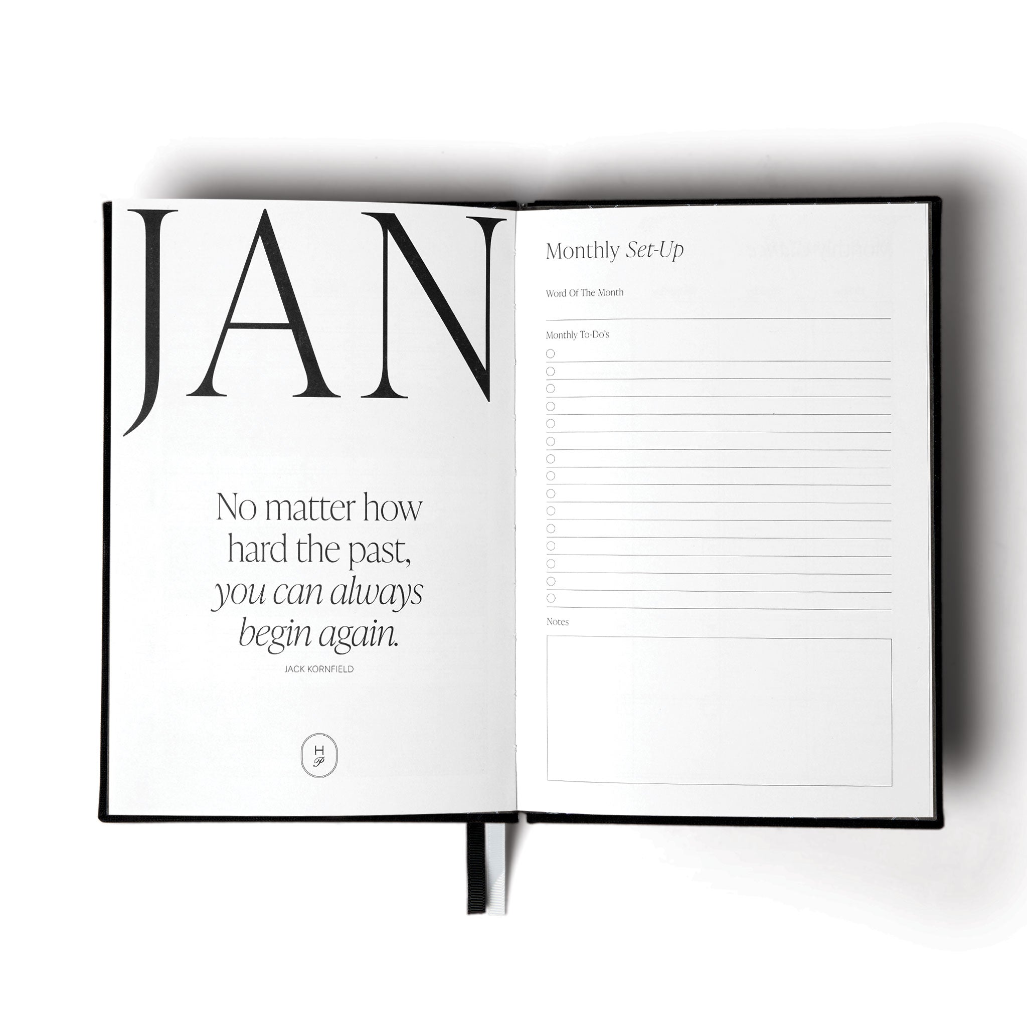 The 2026 Diary by The Head Plan in the colour White open to 'January Monthly Set-Up' and a motivational quote #color_black